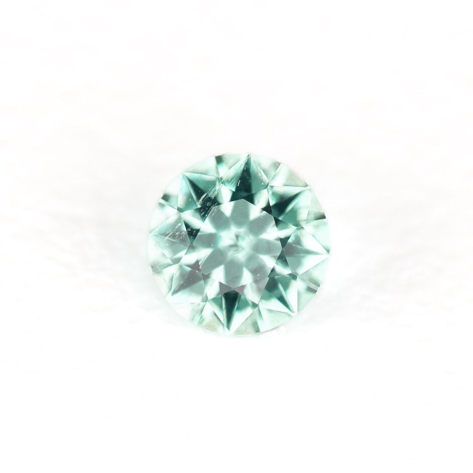 0.13ct ROUND EMERALD