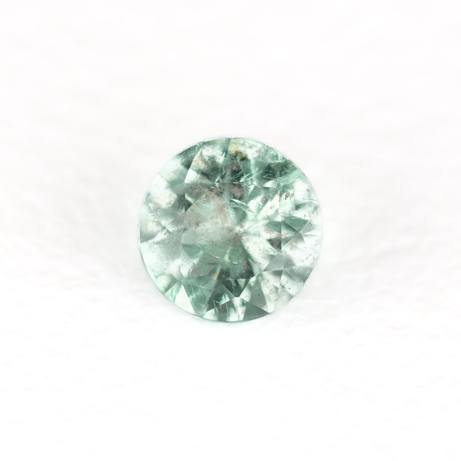 0.16ct ROUND EMERALD